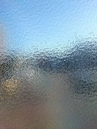 Close-up of water drops on glass window