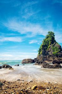 Scenic view of sea against blue sky