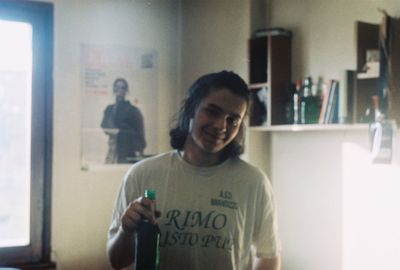 Portrait of smiling man standing at home