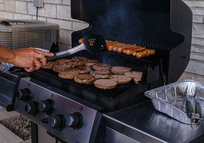 Cropped hand of man preparing food