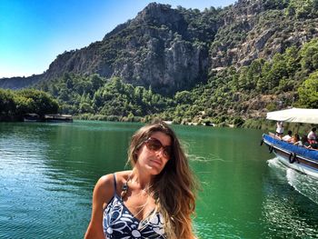 Portrait of young woman in water