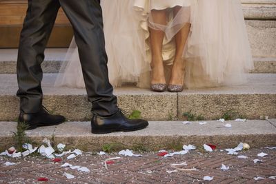 Low section of people standing on footpath