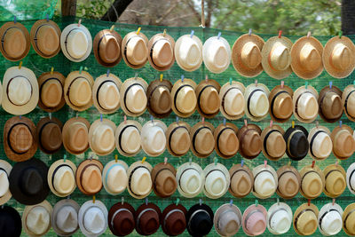 High angle view of various hats hanging for sale in market