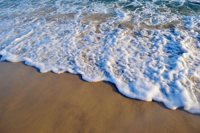 High angle view of waves on beach