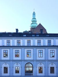 Low angle view of building against blue sky