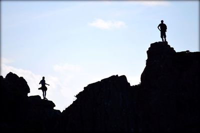 Silhouette of people standing on landscape