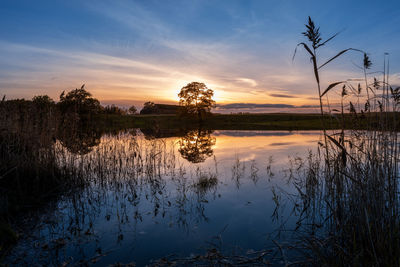 Reflective sunset over the lake