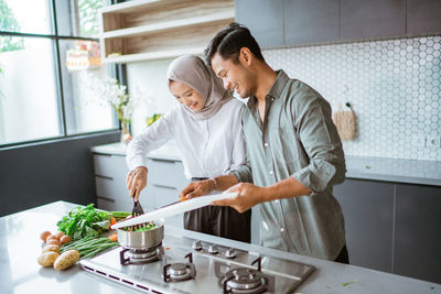 Side view of man working at home