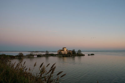 Scenic view of sea against clear sky during sunset