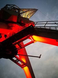 Low angle view of illuminated built structure against sky