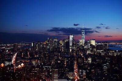Aerial view of city lit up at night
