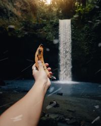 Midsection of woman holding hand