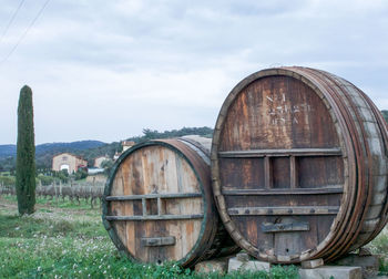 Abandoned barn on field against sky