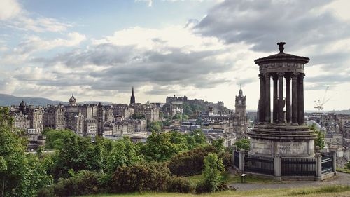 Dougald stewart monument at calton hill against sky in city