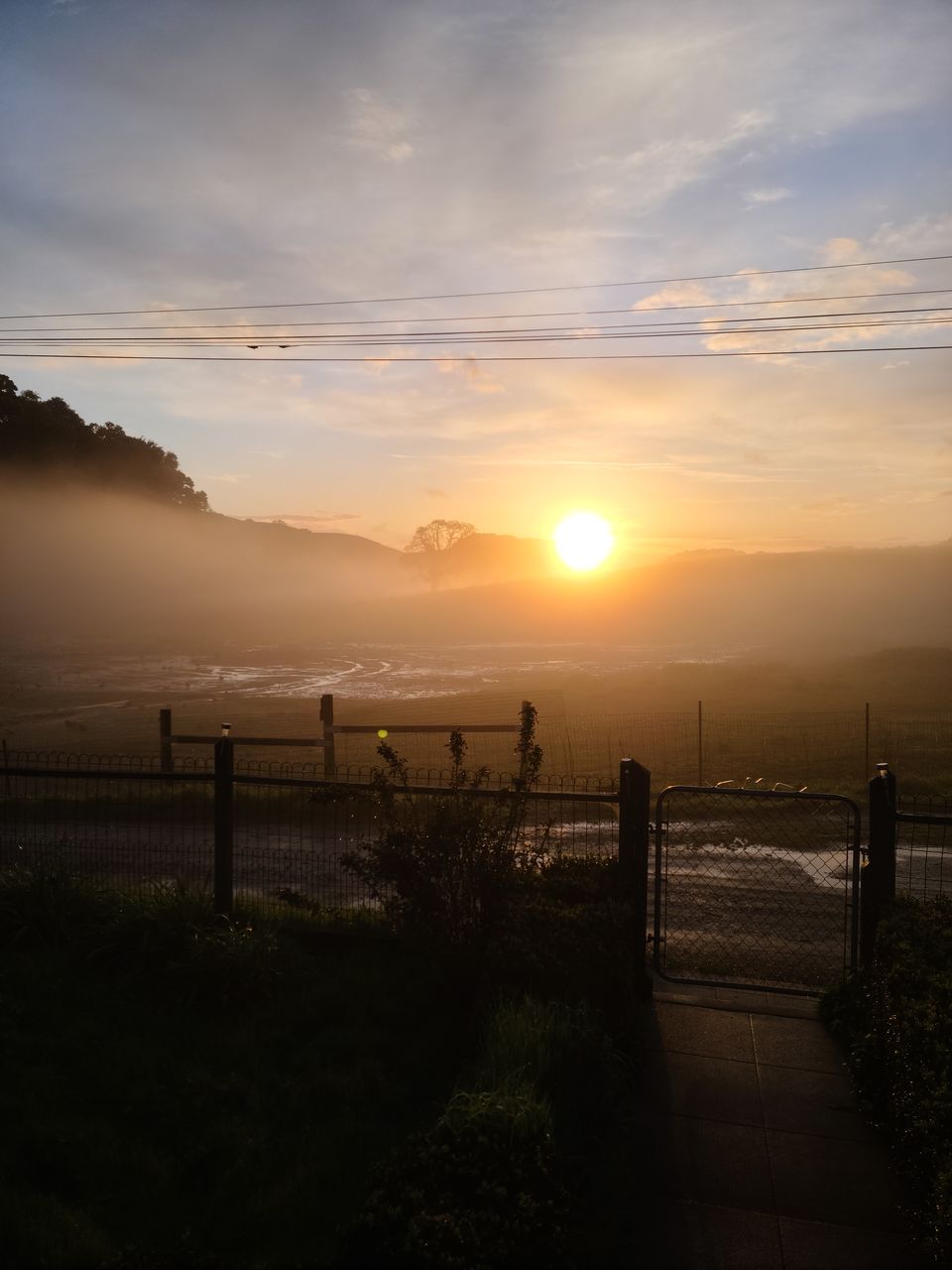 sunlight, light, reflection, sky, morning, darkness, nature, water, cloud, sun, beauty in nature, scenics - nature, sunbeam, outdoors, environment, tranquility, silhouette, no people, dawn, architecture, sunrise, landscape