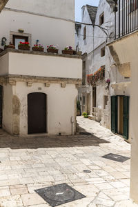 Alley amidst buildings in city