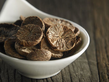 Close-up of nutmeg in bowl