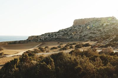 Scenic view of beach against clear sky