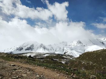 Scenic view of snowcapped mountains against sky