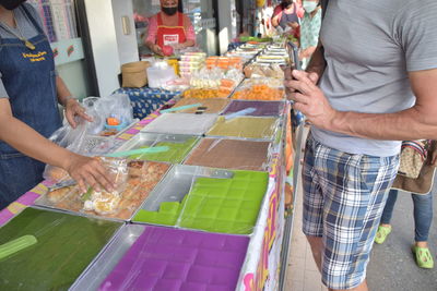 Buying thai sweets at hat yai vendor 