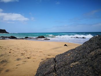 Scenic view of beach against sky