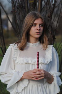Portrait of young woman looking away