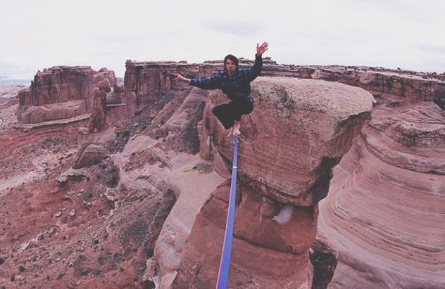 rock - object, rock formation, men, lifestyles, sky, leisure activity, mountain, travel, tourism, full length, tourist, day, nature, tranquility, travel destinations, cliff, famous place, tranquil scene