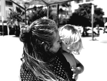 Portrait of mother and daughter outdoors