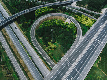 High angle view of road amidst trees in city