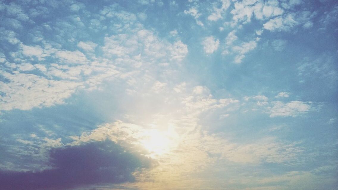 sky, low angle view, cloud - sky, beauty in nature, tranquility, sky only, scenics, tranquil scene, nature, backgrounds, blue, cloudscape, full frame, cloudy, idyllic, cloud, outdoors, no people, majestic, sunlight