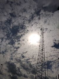 Low angle view of communications tower against sky