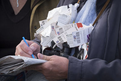 Close-up of hand holding paper