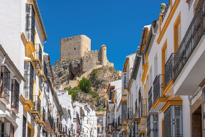 Low angle view of buildings against clear sky