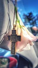 Close-up of cross hanging against blurred background