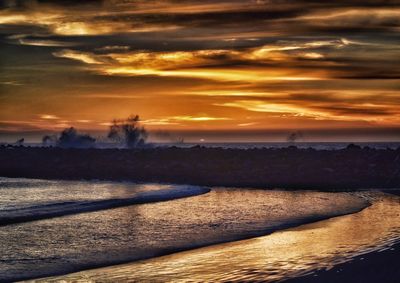 Scenic view of landscape against sky during sunset