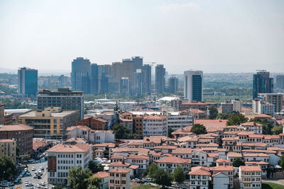 High angle view of buildings in city against sky