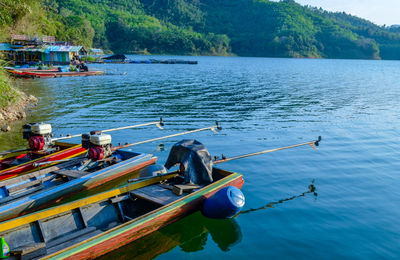 Boats moored in lake