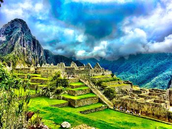 Scenic view of landscape against cloudy sky