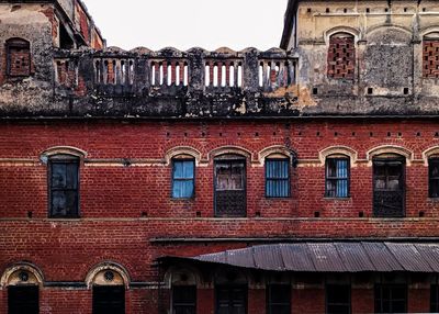 Low angle view of old building against sky