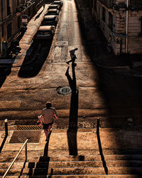 High angle view of people walking on footpath