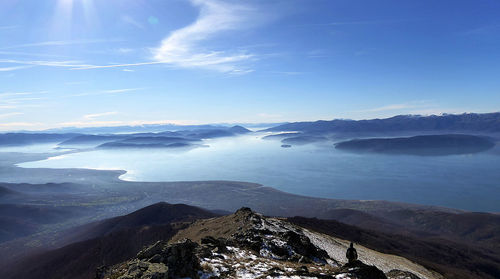 Scenic view of mountains against blue sky