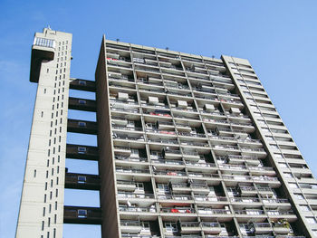 Low angle view of modern building against clear blue sky