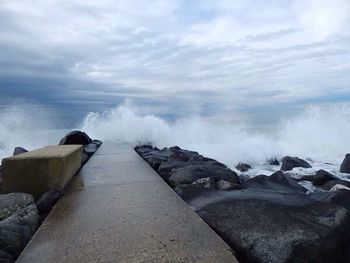 Scenic view of sea against cloudy sky
