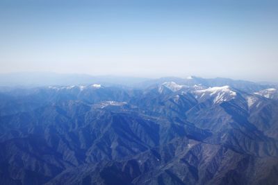 Scenic view of mountains against sky during winter