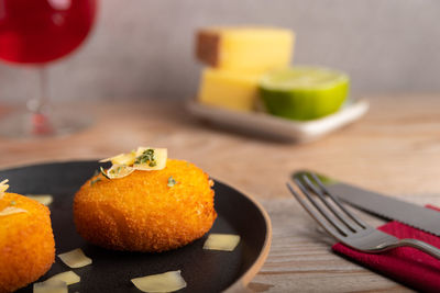 Close-up of fruits in plate on table