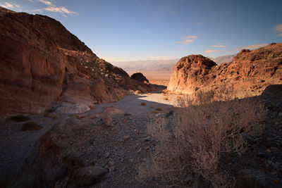 Scenic view of desert against sky during sunset