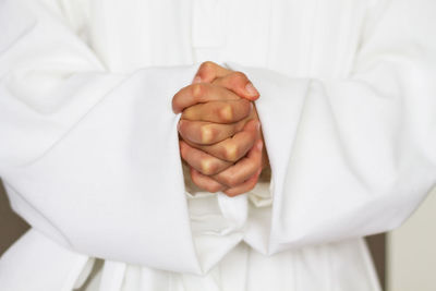 Close-up of hands in prayer