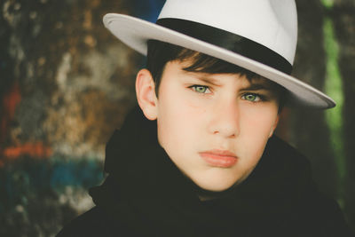 Close-up portrait of boy wearing hat