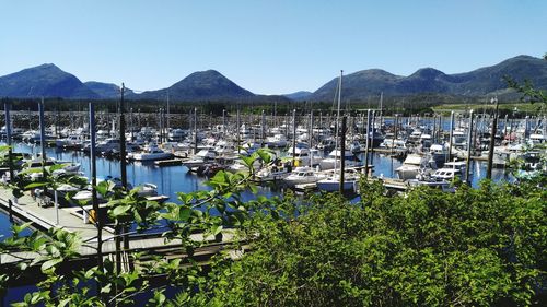 Calm sea with mountain range in background