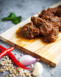 High angle view of meat on cutting board